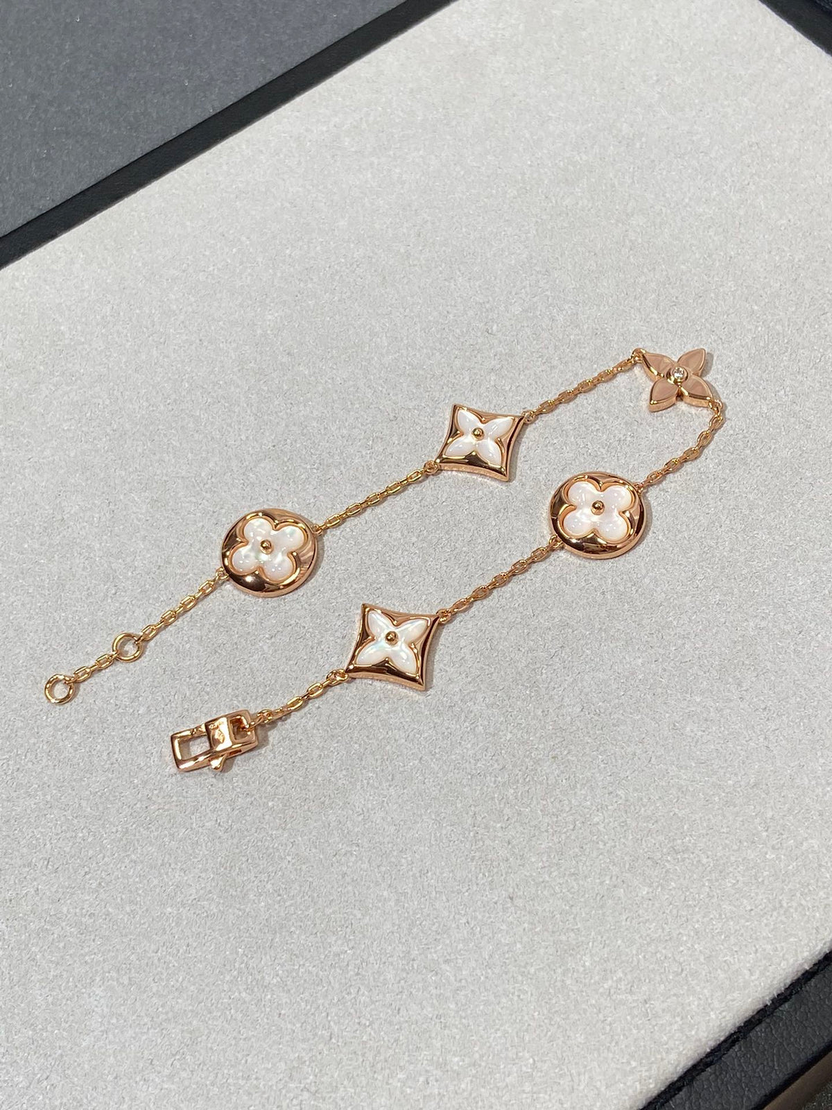 ??MIRA?¡¥STAR AND SUN 5 MOTIF MOP PINK GOLD BRACELET