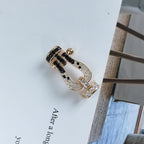 ??MIRA?¡¥FORCE LARGE HORSESHOE BLACK WHITE DIAMOND BRACELET ROSE GOLD